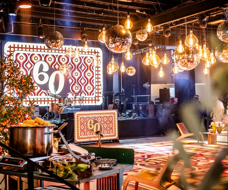 60th birthday event with retro decor and disco balls.